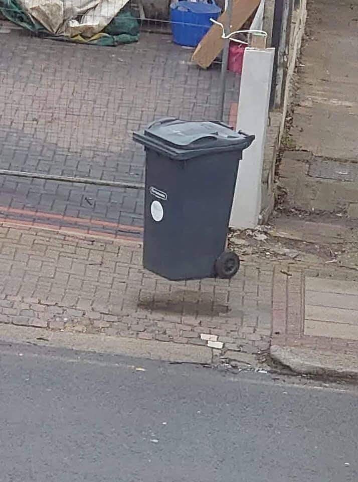 If you see this wheely bin floating, you have been in the house too long. It is just a wet spo...jpg