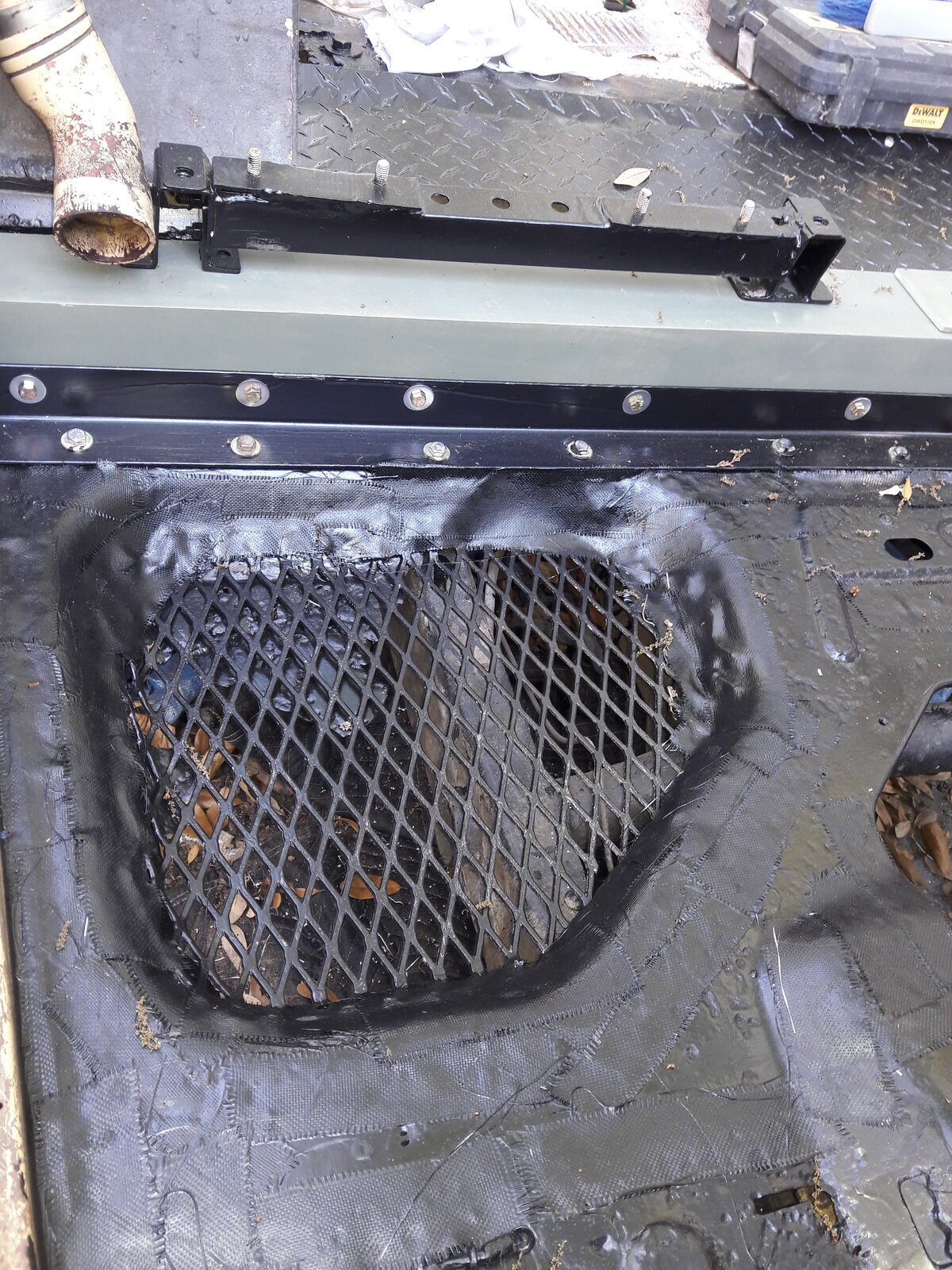 Rusted hole below tank repair.jpg