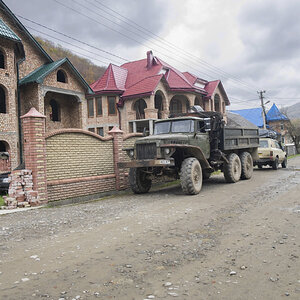 cruiser and truck by house.JPG