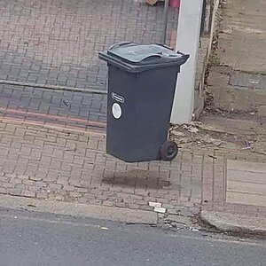 If you see this wheely bin floating, you have been in the house too long. It is just a wet spo...jpg