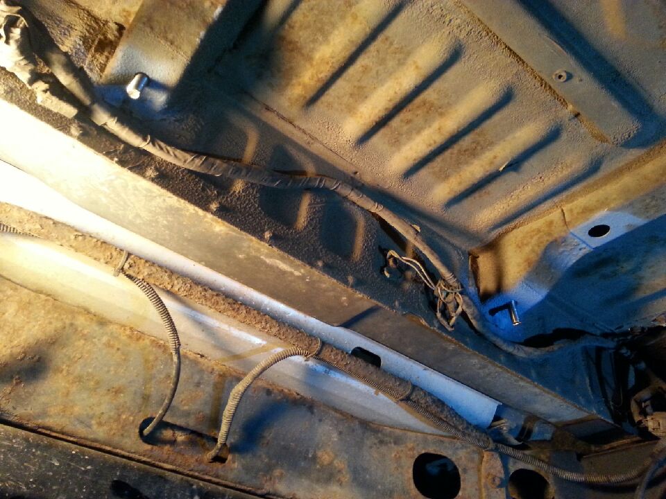 2 - holes drilled for straps bolts dropped in.JPG