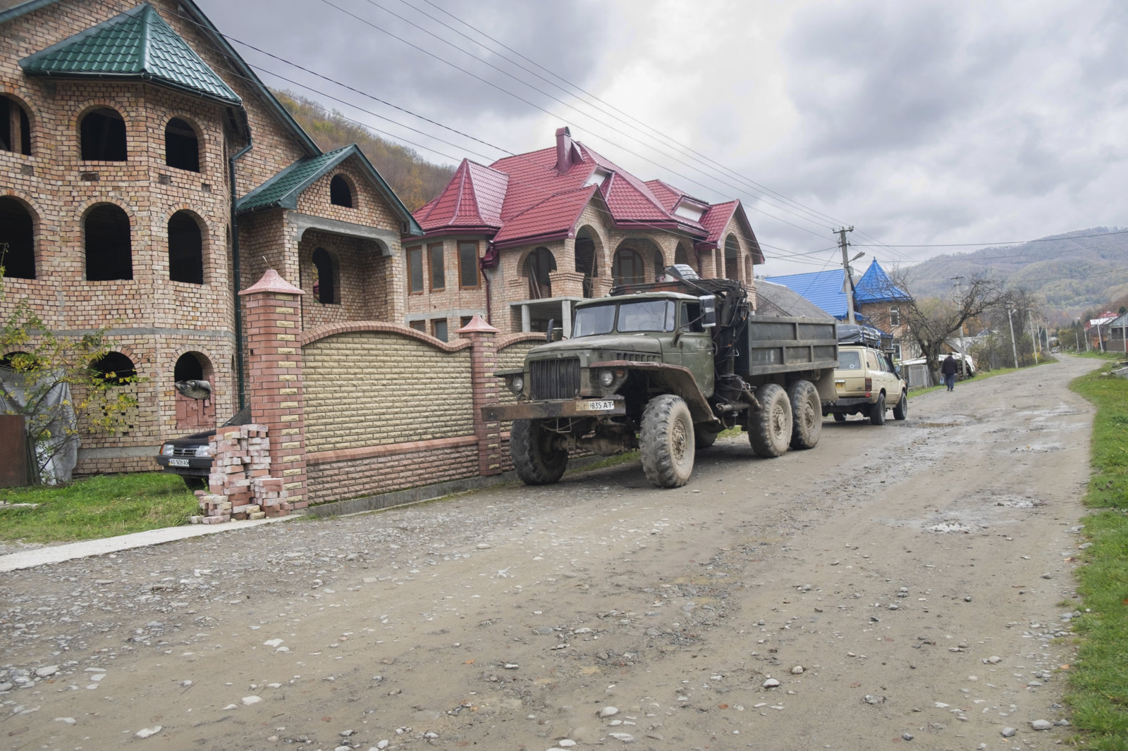 cruiser and truck by house.JPG